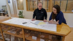 Owner Steve Salsury looks over plans with Vice President Tara Hartson