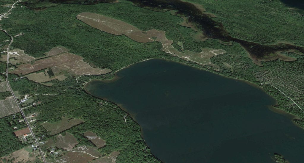 aerial photo of lake and land to be divided